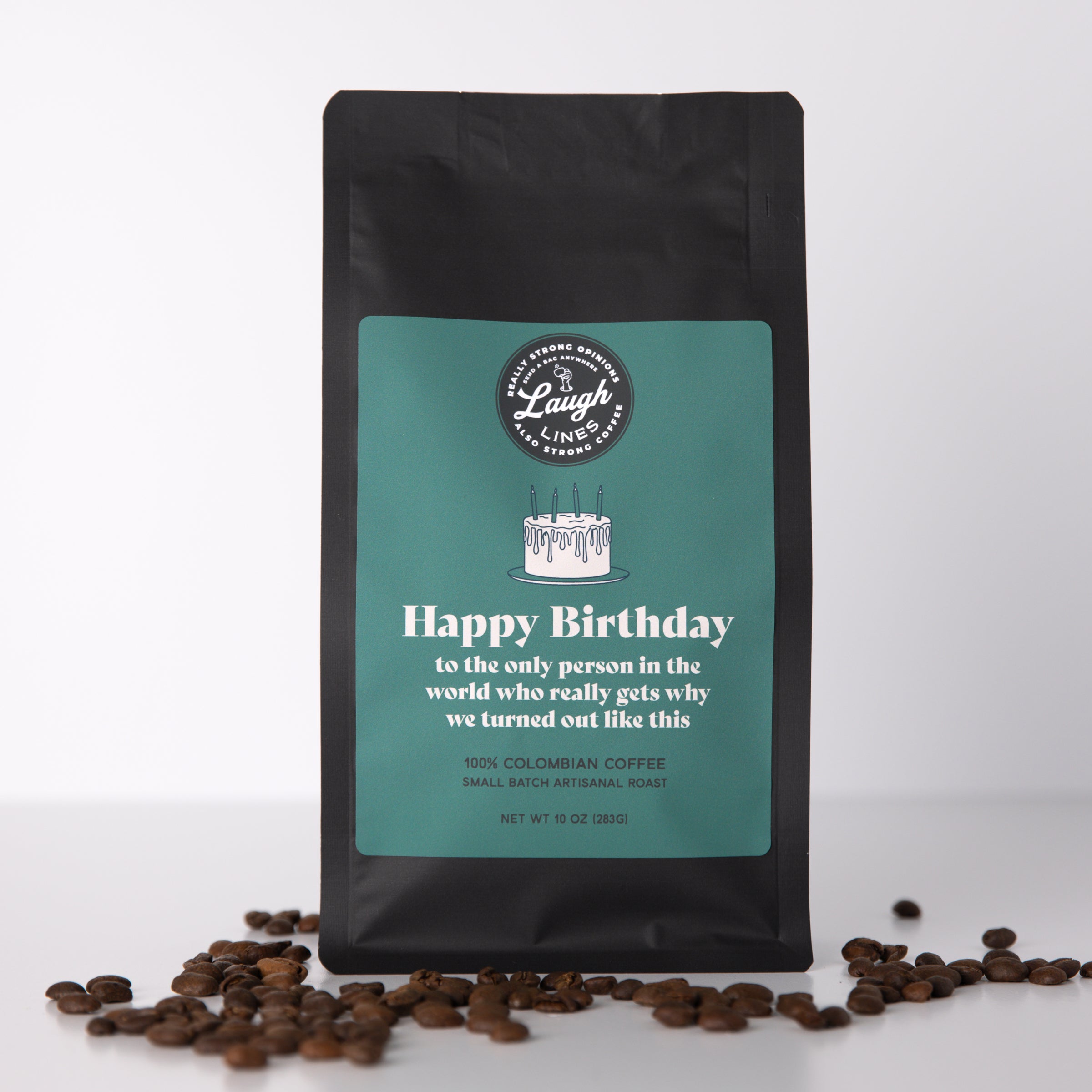 Coffee bag with 'Happy Birthday to the only person in the world who really gets why we turned out like this' message and coffee beans on a white background