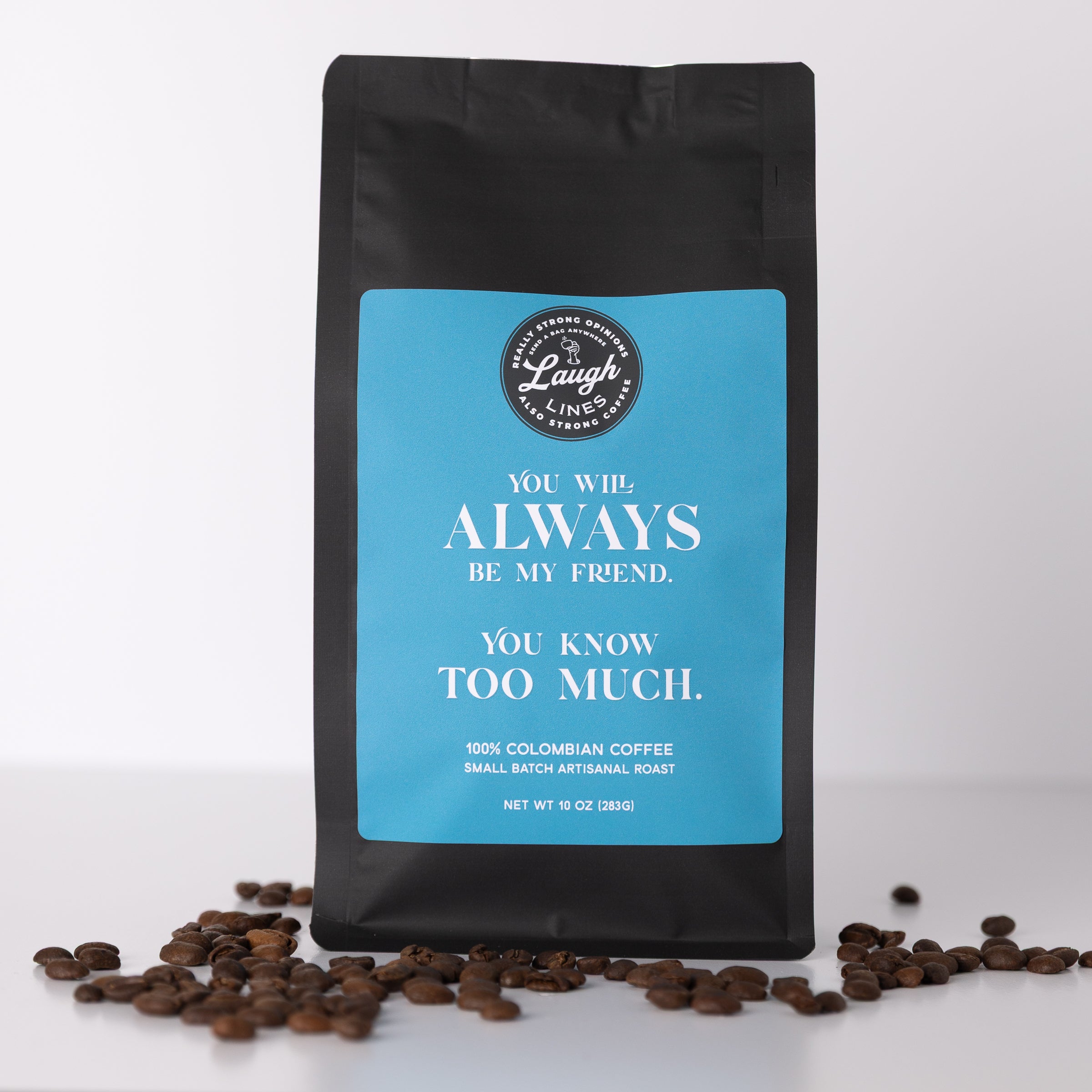 Coffee bag with a humorous message that says 'You Will Always Be My Friend. You Know Too Much' and coffee beans on a white background