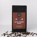Coffee bag with 'Coffee. Lacrosse. Repeat.' text and coffee beans on a white background