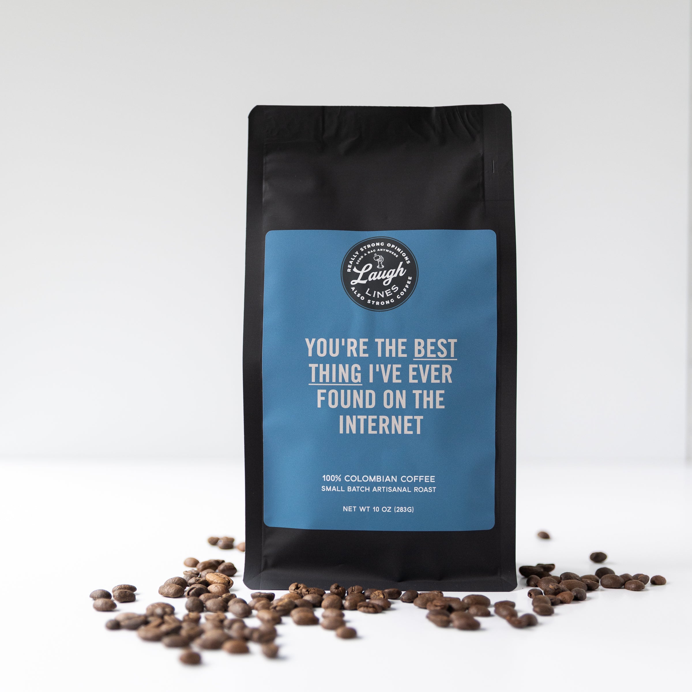 Coffee bag with text that reads "You're the Best Thing I've Found on the Internet' and coffee beans on a white background