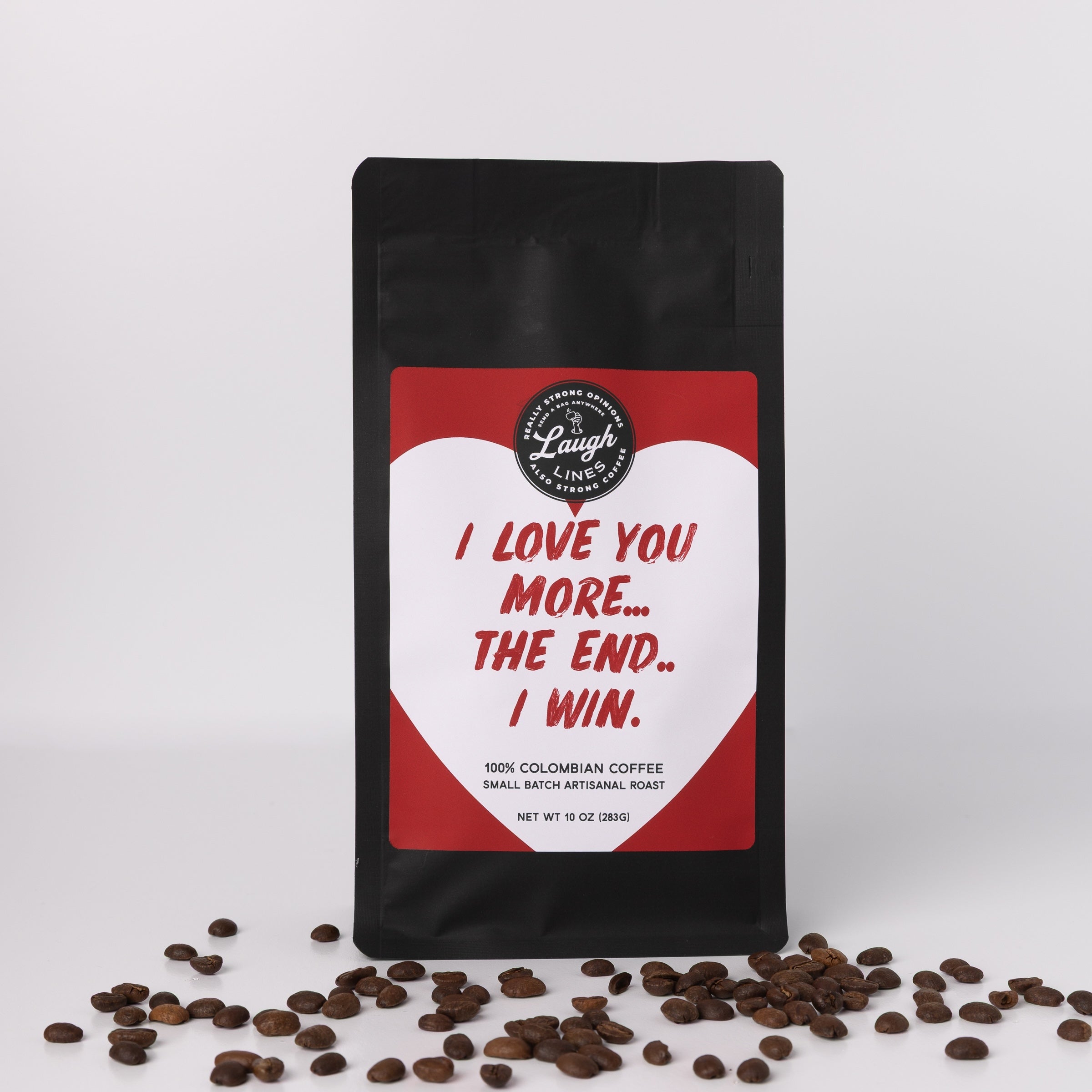 Coffee bag with humorous text that reads 'I Love You More...The End..I Win.' and coffee beans on a white background