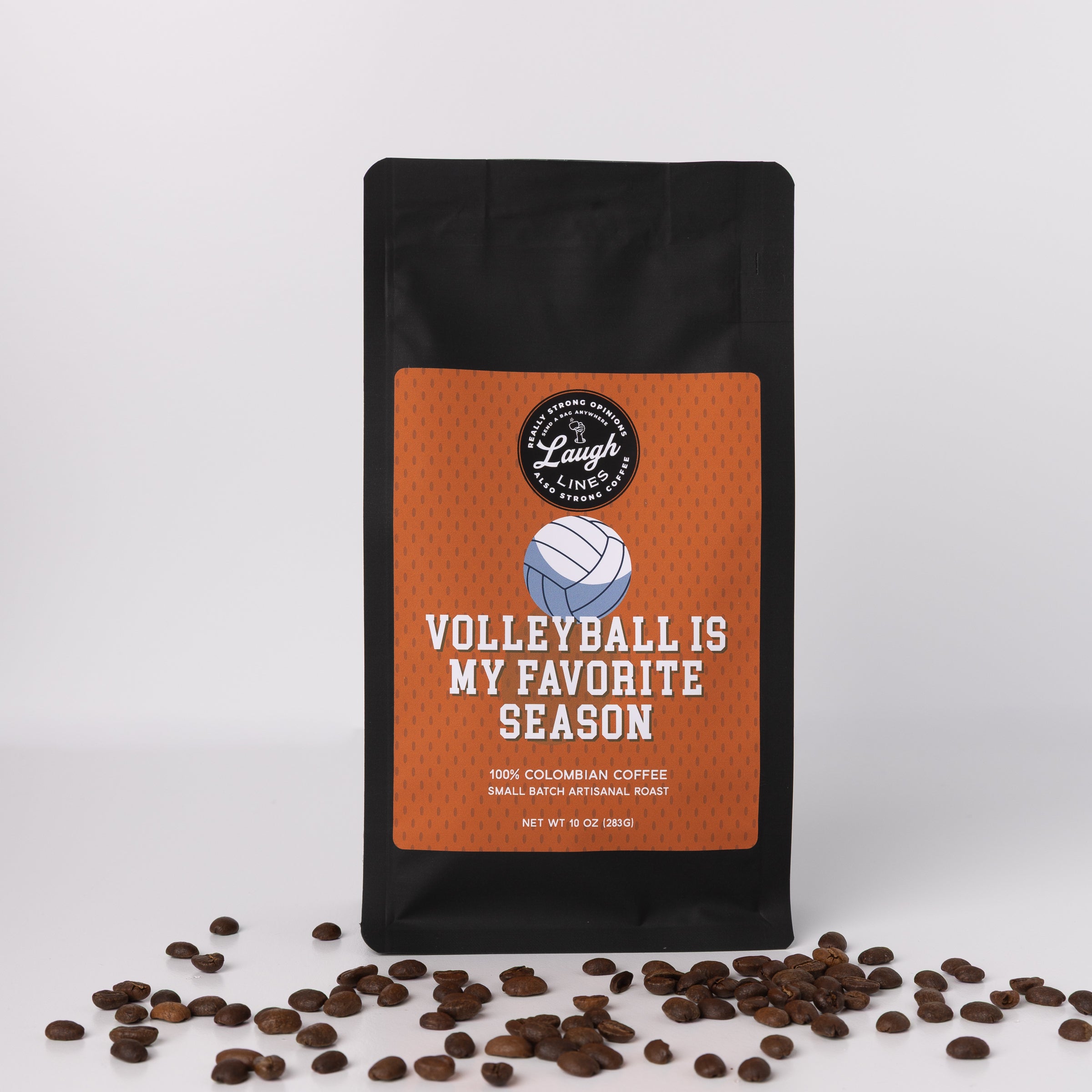 Coffee bag with 'Volleyball is my favorite season' text and scattered coffee beans on a light gray background